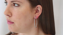 Load and play video in Gallery viewer, Sterling Silver Rhodium-plated CZ In and Out Hinged Hoop Earrings
